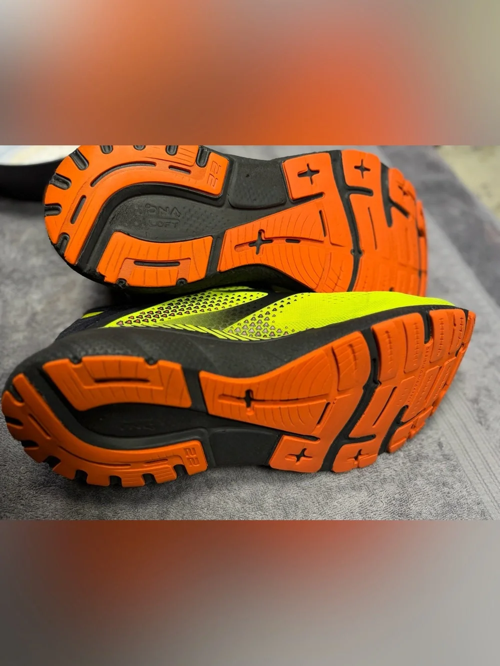 Brooks Adrenaline GTS 22 men's running shoes in a bright neon yellow, black